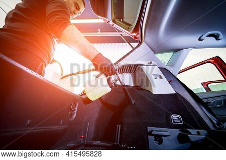 A Car Service Worker Cleans Interiror With A Special Foam Generator
