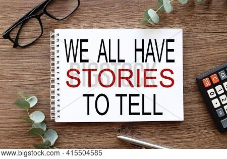 We All Have Story To Tell. Text On White Paper On Wood Table Background