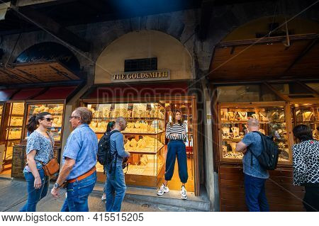 October 11, 2018.tuscany.italy.florence: Jewelry Store Clerk And Tourists On The Ponte Vecchio Bridg