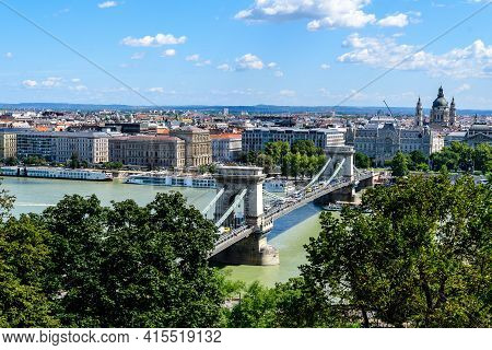 Landscape With Old Historical Széchenyi Chain Bridge Over Danube And Clear Blue Sky In Budapest City
