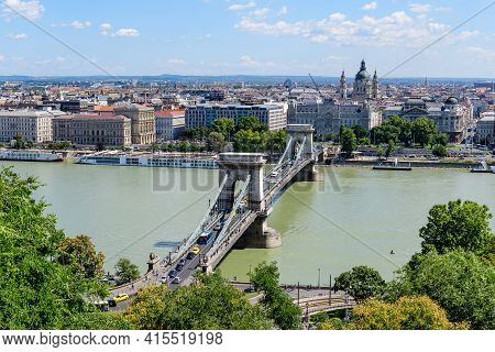 Landscape With Old Historical Széchenyi Chain Bridge Over Danube And Clear Blue Sky In Budapest City