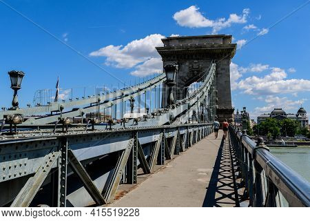 View Of Old Historical Széchenyi Chain Bridge Over Danube With Clear Blue Sky In Budapest, Hungary