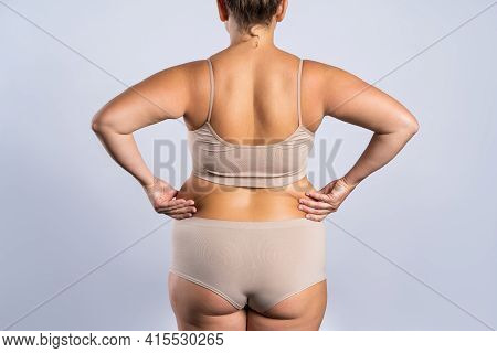 Overweight Woman With Fat Hips And Buttocks, Obesity Female Body On Gray Background