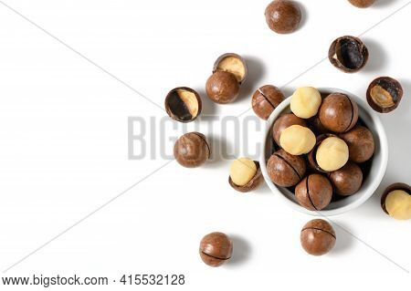 Peeled Macadamia Nuts In Bowl Isolated On White Background, Macadamia Nuts Are Loaded With Flavonoid