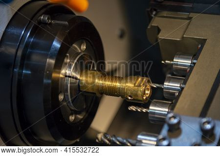 The  Operation Of Multi-tasking Cnc Lathe Machine Swiss Type Cutting The Hi-precision Part. The Hi-t