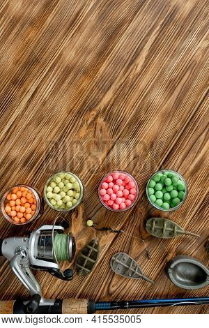 Accessories For Carp Fishing And Fishing Baits On Wooden Planks With Copy Space