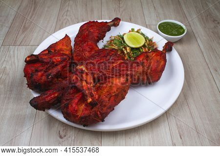 Tandoori Chicken Is Chicken Dish Prepared By Roasting Chicken Marinated In Yoghurt And Spices In A T
