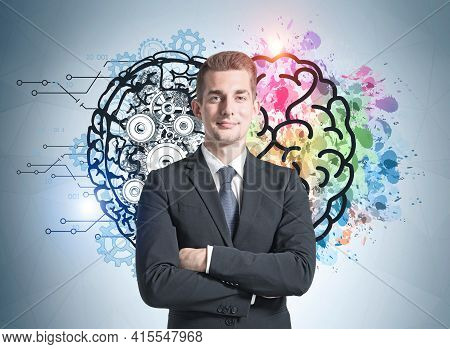 Positive Successful Businessman Is Smiling And Having His Arms Cross Handed. Concept Of Balance Betw