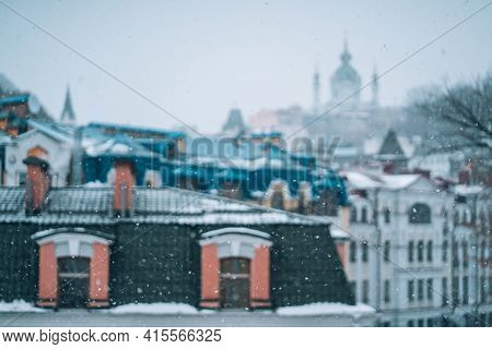 Copious Snowfall Over The City With The Roofs
