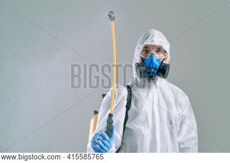 Employee Of Decontamination Services Decontaminating The Room.
