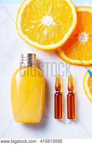 Vitamin C, Natural Anti Aging Cosmetics Cream Bottle And Serum Ampulas