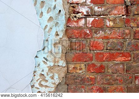 An Old Damaged Brick Wall Partially Covered With Two Layers Of Plasterwork As A Background