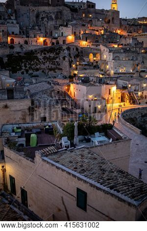 Matera, Italy - September 20, 2019: Evening View Of The City Of Matera, Italy, With The Colorful Lig
