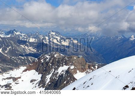 Mountain Snow Panorama On Main Chain Of The Alps Seen From Summit Wildspitze And Blue Sky In Tyrol A