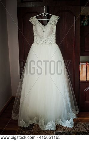 White Wedding Dress On The Cloth Hanger