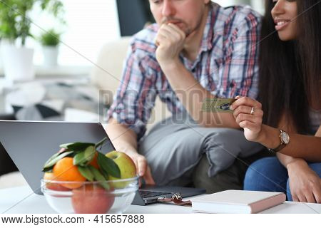 Man And Woman Make An Online Purchase Over Internet