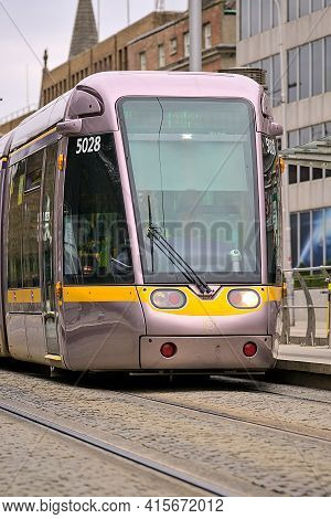 Dublin, Ireland - March 4, 2021: Beautiful Vertical Closeup View Of Luas Tram In Dublin City Centre 