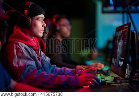 International Gaming Event. Arena For Conducting Esports Competitions. Young Players With Headphones