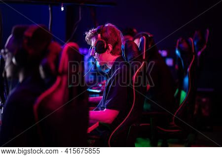 Training Bootcamp For Professional Esports Players. Young Cyber-athletes Play An Online Shooter Game