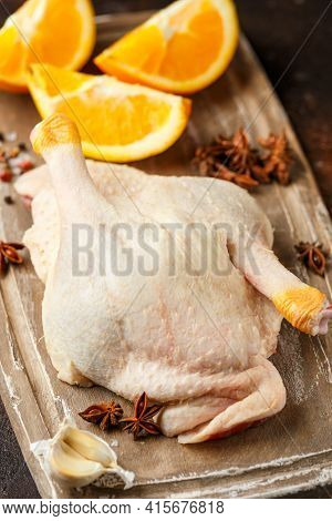 Raw Fresh Free Range Duck Legs On Wooden Board With Ready To Cook
