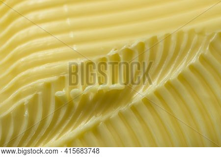 Close Up Of Yellow Butter. Full Frame Textured Background, With A Super Macro Perspective. Serrated 