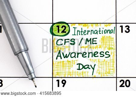 Reminder International Cfs/ Me Awareness Day In Calendar With Pen. May 12