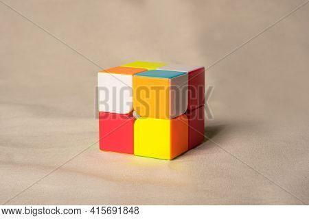 Araras, São Paulo, Brazil, April 4, 2021, Magic Cube On Beige Fabric, Selective Focus.