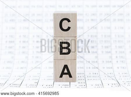 Three Wooden Cubes - Letters Cba Meaning Cost Benefit Assessment On Them