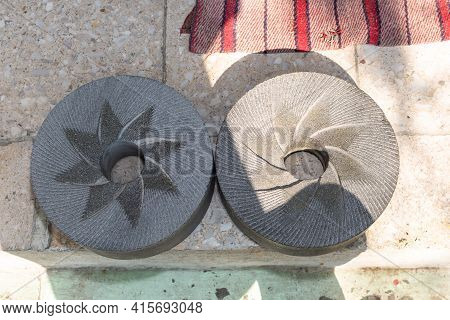 Stones Used To Grind Corn Lying On The Ground After Correct Rectification