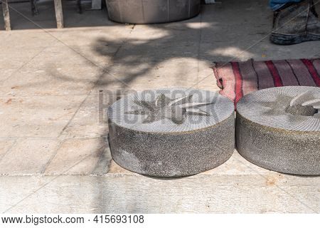 Stones Used To Grind Corn Lying On The Ground After Correct Rectification