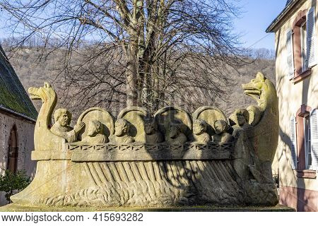 Neumagen, Germany - February 20, 2021: Stone Statue Of  The Ship Of A Wine Merchant With Barrels In 