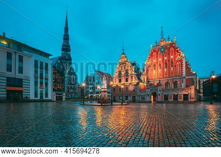 Riga, Latvia. Scenic Town Hall Square With St. Peters Church, Schwabe House, House Of Blackheads Dur