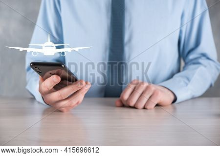 Businessman Holding An Airplane Icon In His Hands. Online Ticket Purchase.travel