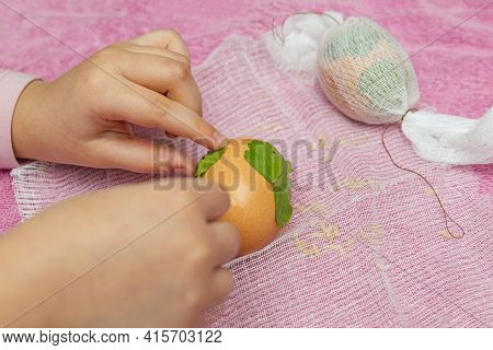 The Process Of Dyeing Eggs Into Onion Husks. Ecological Coloring Of Eggs For Easter. Drawing From Pa