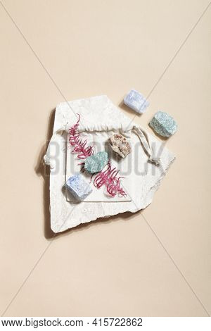 Many Crystal Minerals With Dry Fern On Beige Background. Magic Rock For Crystal Ritual, Witchcraft, 