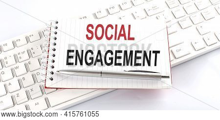 Text Social Engagement On The Keyboard On The White Background