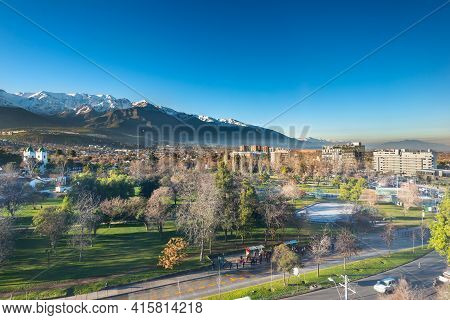View Of Los Dominicos Park And Neighborhood With Los Andes Mountain Range As A Backdrop In Las Conde