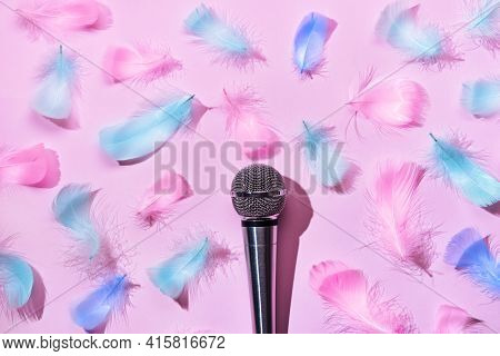 Microphone And Soft Feathers On Pink Background. Asmr Recording Stress Relieving Sounds Concept, Fla