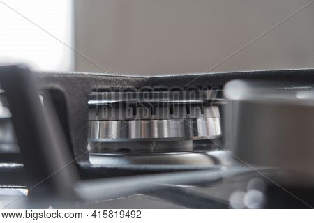 Silver Pan On A Modern Silver Gas Stove In The Kitchen Close-up.