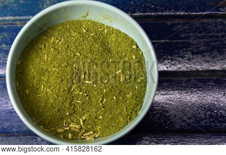 Canister With Yerba Mate On Blue Background. Yerba Mate Is A Medicinal Plant That Has A Thin Gray St
