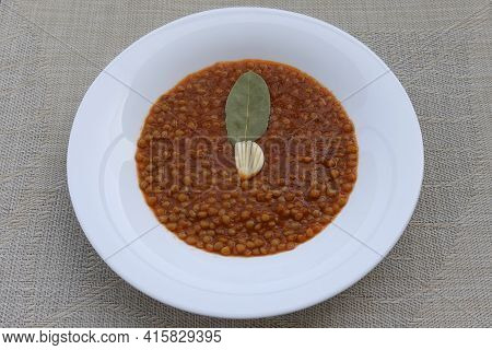 Lentil Soup With Tomato Sauce Garlic And Laurel Leaf. Greek Food.