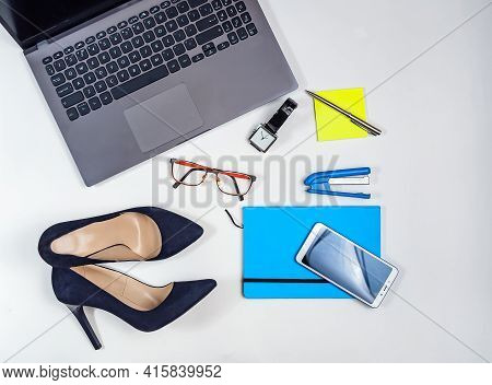 Office Kit Of Businesswoman On The White Background. Laptop, Notebook, нigh Heels, Watches, Glasses,