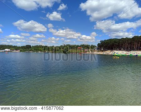 Wide Angle Shot Of A Man Made Lake Lagoon Named Kryspinow With Water Ride Boat Located In A Village 