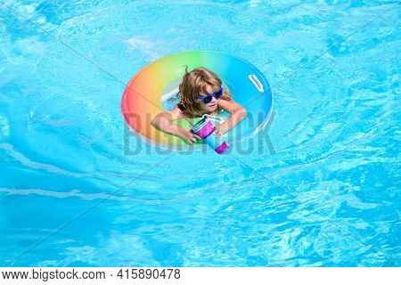 Kid With Cocktail On Watter Pool In The Summer