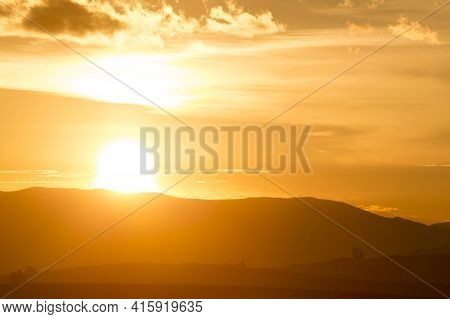 Orange Sunset On The Andean Mountains In The Sacred Valley Near Cusco. Peru