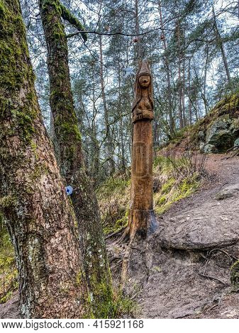 Wooden Sculpture of a fairy at the edge of the fairy path in Virton, Luxembourg, Belgium