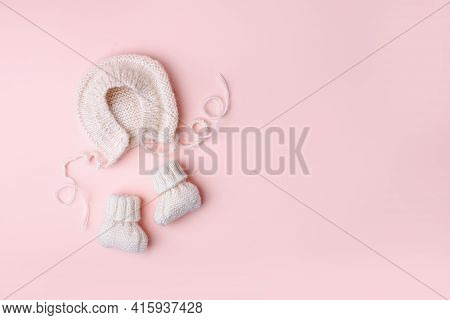 Pale Pastel Cute Baby Handknitted Bonnet And Booties Socks. Set Of Kids Clothes And Accessories. Fas
