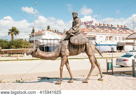 Evrenseki, Turkey - 03.16.2021 Element Of The Sculptural Composition Camel Caravan. A Camel Driver I