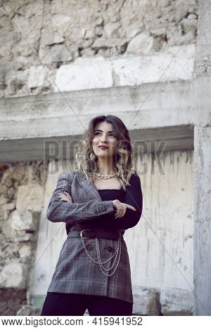 Attractive Young Woman With Makeup And Hairstyle, Posing With Atittude Outside.