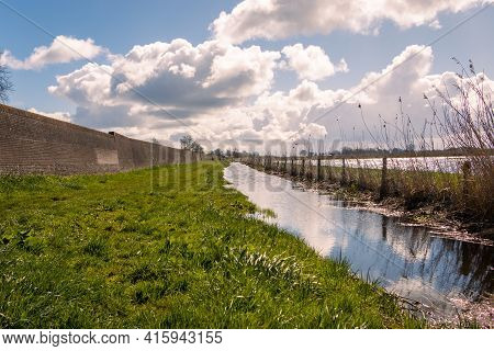 The Centuries-old Seawall In The Hanseatic Town Of Hasselt, A Long Masonry Wall Meant To Turn The Fo